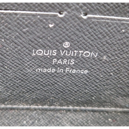 905 - A Louis Vuitton Blue Strand Patent Leather Clutch Bag/Wallet. Zipped interior and open compartments.... 