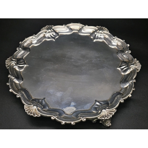 158 - A SOLID SILVER PLATTER MADE BY SPINK & SONS , LONDON IN 1896 .  318gms