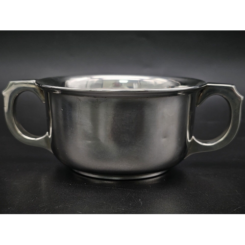 165 - A SOLID SILVER TWIN HANDLED LOVING CUP HALLMARKED 1939 BIRMINGHAM . 140gms