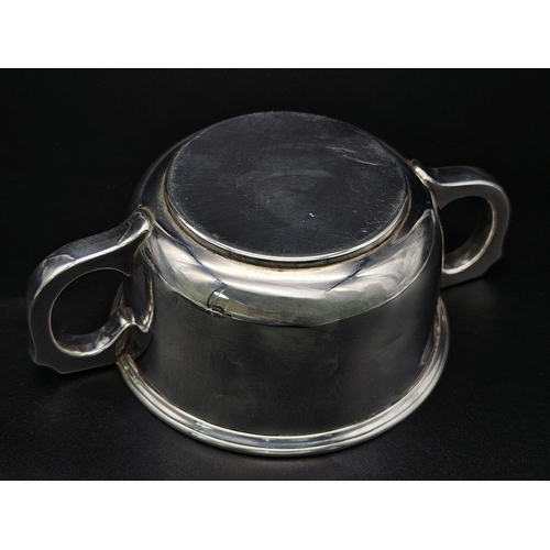 165 - A SOLID SILVER TWIN HANDLED LOVING CUP HALLMARKED 1939 BIRMINGHAM . 140gms