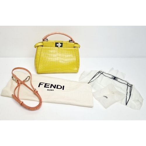 3 - A Fendi Peekaboo Yellow Crocodile Bag. Twist closures. Two interiors with compartments. Silver-tone ... 