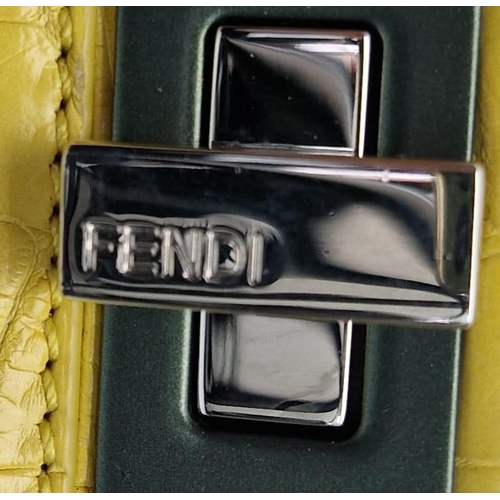 3 - A Fendi Peekaboo Yellow Crocodile Bag. Twist closures. Two interiors with compartments. Silver-tone ... 