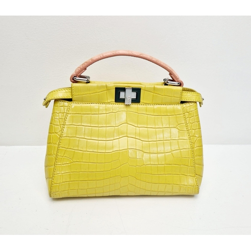 3 - A Fendi Peekaboo Yellow Crocodile Bag. Twist closures. Two interiors with compartments. Silver-tone ... 