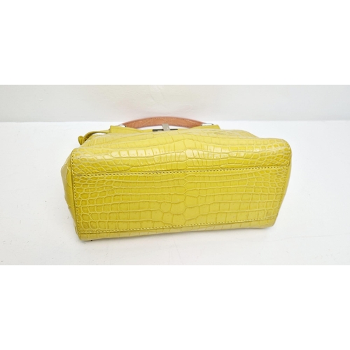 3 - A Fendi Peekaboo Yellow Crocodile Bag. Twist closures. Two interiors with compartments. Silver-tone ... 