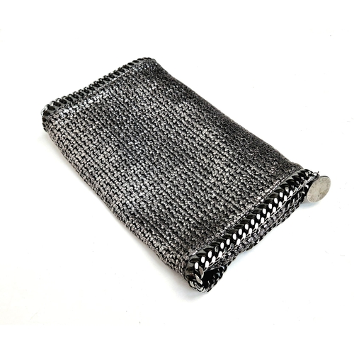 919 - A Stella McCartney Large Silver-Tone Textile Clutch Bag. Silver-tone hardware. Twin flaps. In good c... 