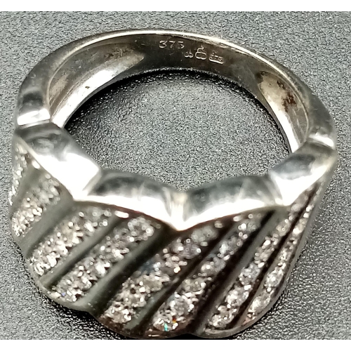 129 - 9K WHITE GOLD DIAMOND FANCY BAND RING.  0.50CT DIAMOND. TOTAL WEIGHT 6.98G.  SIZE M