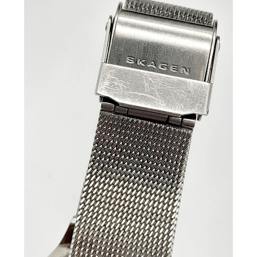 1311 - A SKAGEN OF DENMARK STAINLESS STEEL QUARTZ LADIES WRIST WATCH WITH DIAMOND NUMERALS. a/f