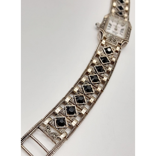 1319 - A MARCEL DRUCKER STONE SET LADIES DRESS WATCH IN STERLING SILVER.