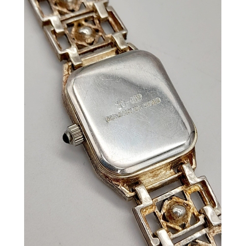 1319 - A MARCEL DRUCKER STONE SET LADIES DRESS WATCH IN STERLING SILVER.