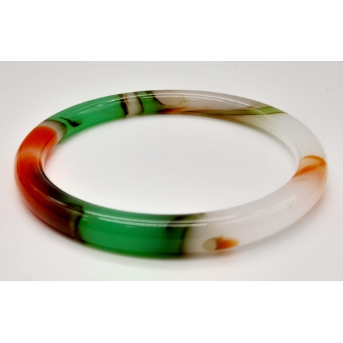 1773 - A Thin Multi-Colour Quality Jade Bangle. 63mm inner diameter. 7mm width.