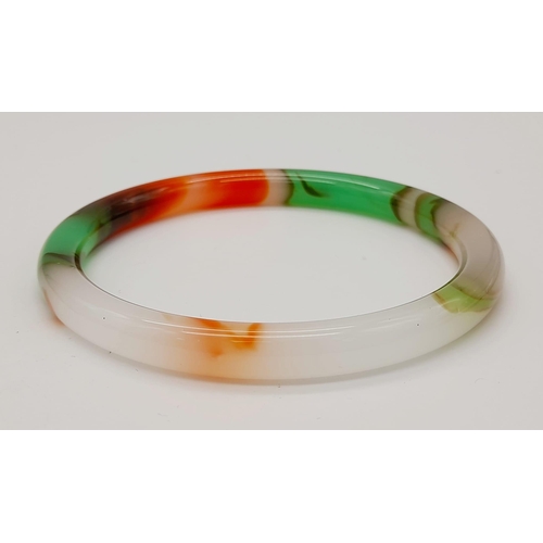 1773 - A Thin Multi-Colour Quality Jade Bangle. 63mm inner diameter. 7mm width.