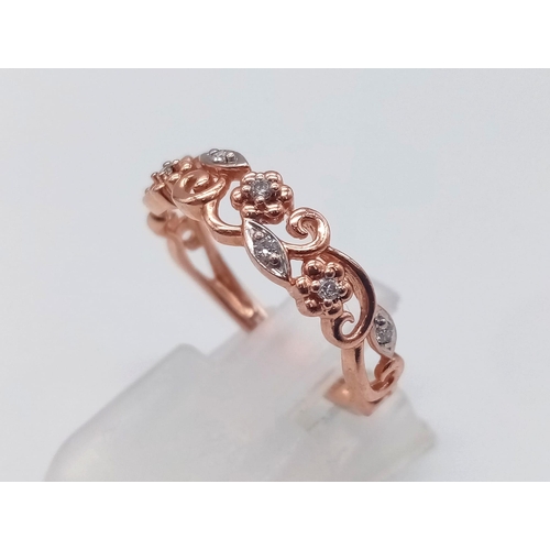 227 - 9K ROSE GOLD DIAMOND SET FANCY BAND RING FLORAL DESIGN. TOTAL WEIGHT  2G. SIZE M