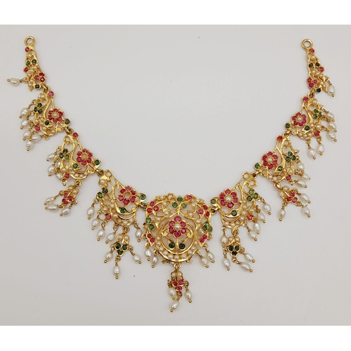 484 - A 20 k yellow gold necklace and pendant with seed pearls, emeralds and rubies (some stones missing) ... 