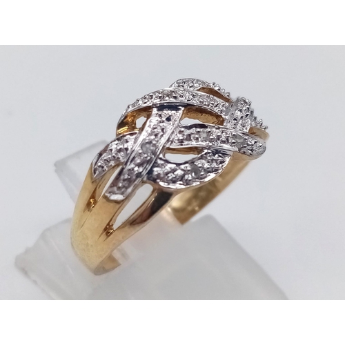 592 - 9K YELLOW GOLD DIAMOND CELTIC STYLE RING. TOTAL WEIGHT 2.7G.  SIZE M