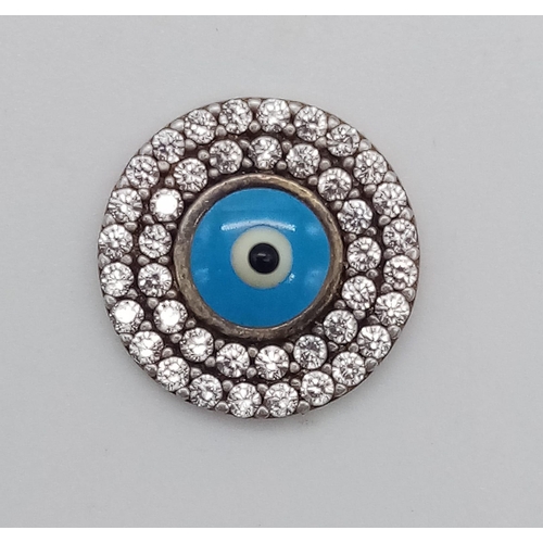 878 - STERLING SILVER STONE SET RING SIZE L AND A SILVER EVIL EYE SET TOKEN. TOTAL WEIGHT 9.24GRAMS