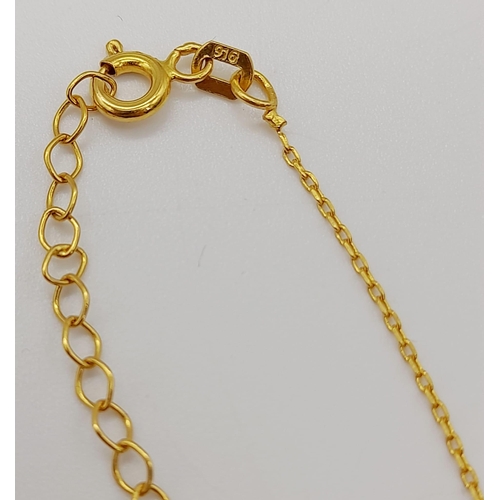 889 - A mixed lot consisting of:
22 K yellow gold pendant 
18 K yellow gold chain necklace with pendant an... 