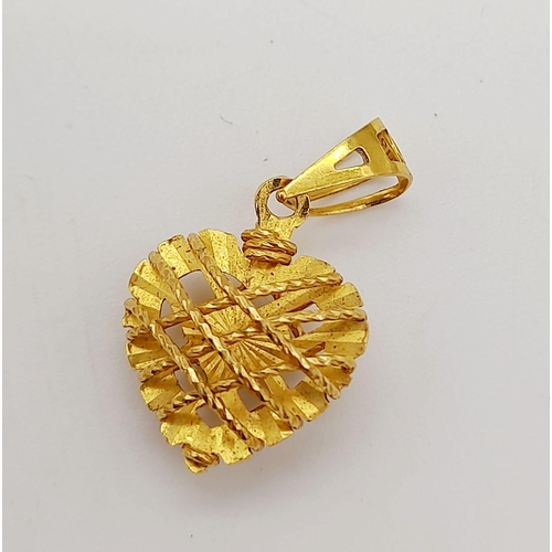 889 - A mixed lot consisting of:
22 K yellow gold pendant 
18 K yellow gold chain necklace with pendant an... 