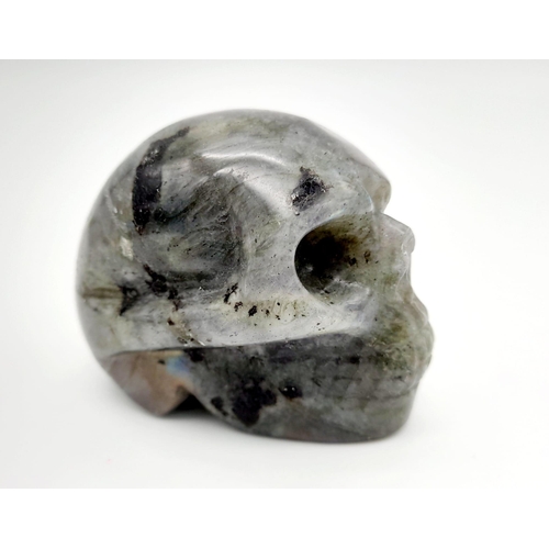 891 - A Menacing Grabbo Jasper Skull Figure. 5 x 4cm.