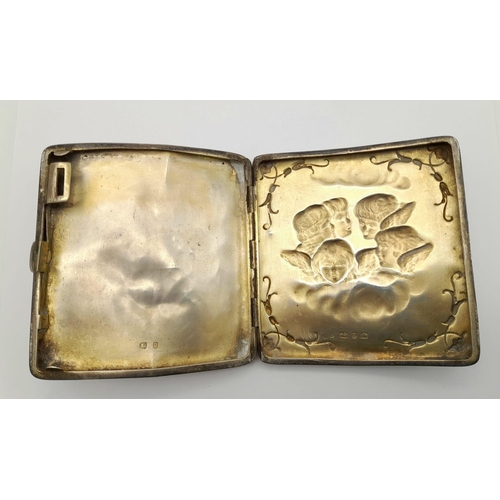 934 - A SOLID SILVER CIGARETTE CASE WITH ANGELS AND CHERUBS HALLMARKED FOR BIRMINGHAM 1898 , A FEW DENTS B... 