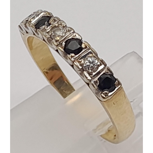 940 - A 9K Yellow Gold Sapphire and White Stone Ring. Size O. 2.4g total weight.