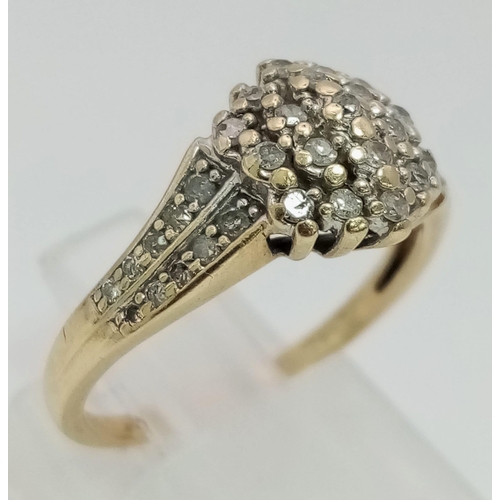 122 - 9K YELLOW GOLD DIAMOND CLUSTER RING.  0.32CT DIAMOND. TOTAL WEIGHT 2.4G.  SIZE N