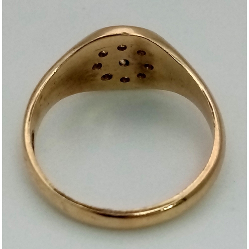 599 - 9K YELLOW GOLD DIAMOND SET SIGNET RING. TOTAL WEIGHT 2.6G.  SIZE K