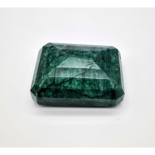 1417 - A Very Large 829ct Rectangular Shaped Step-Cut Emerald.  6.5 x 5cm.