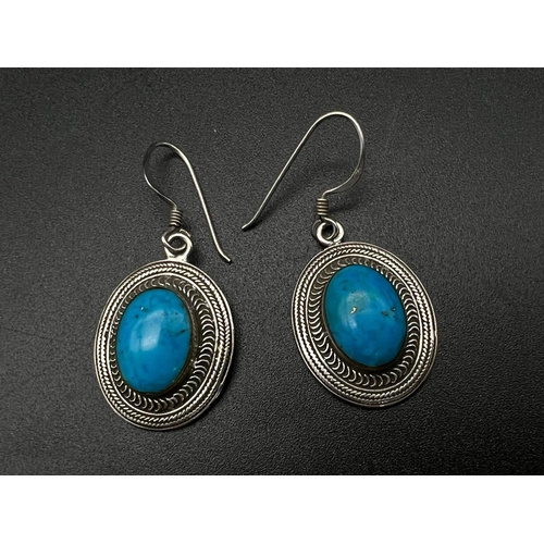 1318 - 2 PAIRS OF SILVER EARRINGS , ONE BLACK ONYX AND THE OTHER TURQUOISE .