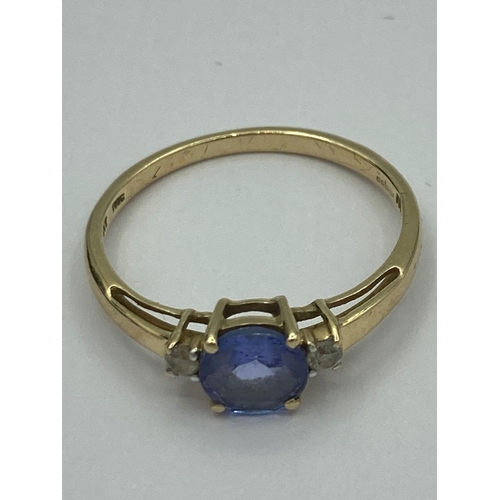 152 - 9 carat GOLD RING having Tanzanite coloured centre stone with Aqua Gemstone detail to shoulders. Ful... 