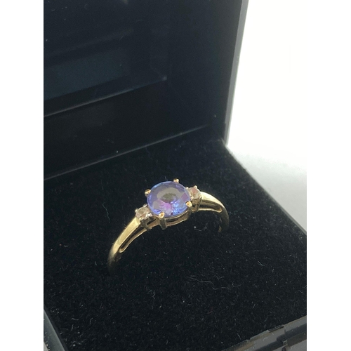 152 - 9 carat GOLD RING having Tanzanite coloured centre stone with Aqua Gemstone detail to shoulders. Ful... 