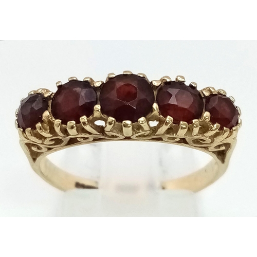 444 - A Vintage 9K Yellow Gold Red-gemstone Ring. Size O. 2.55g total weight.