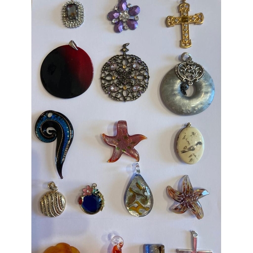 496 - Large collection of jewellery pendants to include enamelled, glass, jewelled etc. Please check with ... 