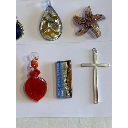 496 - Large collection of jewellery pendants to include enamelled, glass, jewelled etc. Please check with ... 