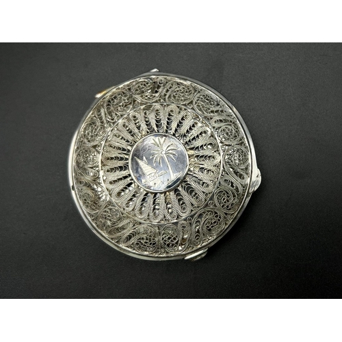 562 - A Unique Vintage Middle Eastern Silver Filigree Palm Detailed Mirror Compact 7cm Diameter 103 grams.