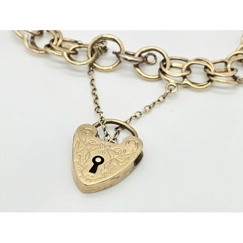 11 - A 9k Yellow Gold Charm Bracelet With Heart Clasp. Only four charms but one of them is a Dolphin! 20c... 