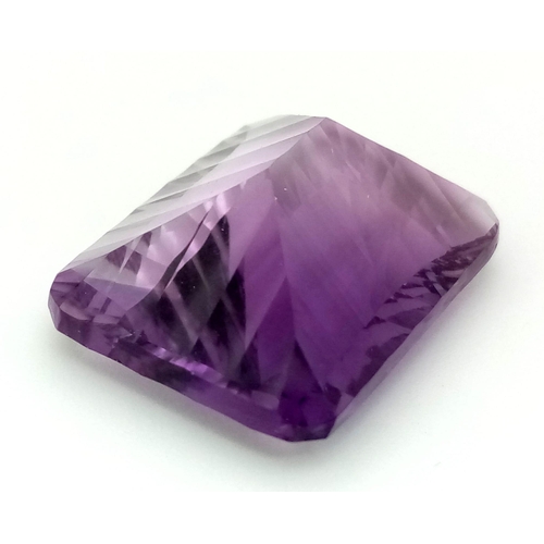 358 - A 31.26ct Concave Octagon Shaped, Clean Cut Eye African Amethyst Gemstone. Comes complete with GFCO ... 