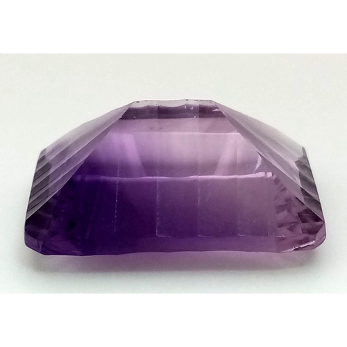 358 - A 31.26ct Concave Octagon Shaped, Clean Cut Eye African Amethyst Gemstone. Comes complete with GFCO ... 