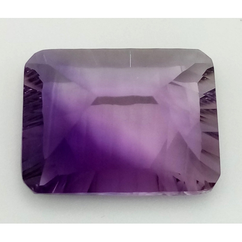 358 - A 31.26ct Concave Octagon Shaped, Clean Cut Eye African Amethyst Gemstone. Comes complete with GFCO ... 