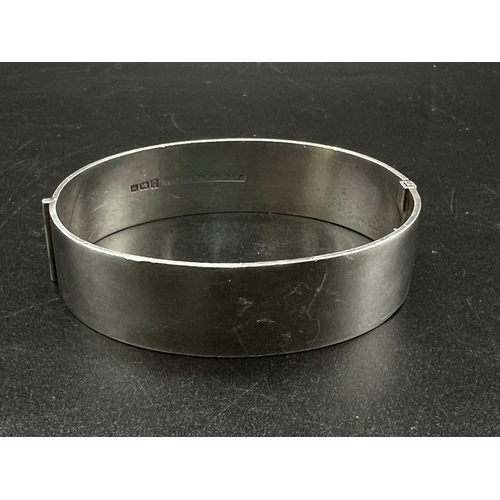 393 - STERLING SILVER ENGRAVED PATTERNED BANGLE 35.4G