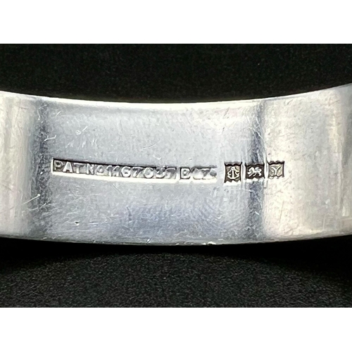 393 - STERLING SILVER ENGRAVED PATTERNED BANGLE 35.4G