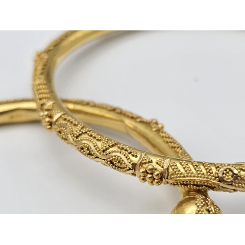 749 - Withdrawn
Two 22 K yellow gold bangles and a pair of earrings, Total weight: 53 g. REF: 01012344