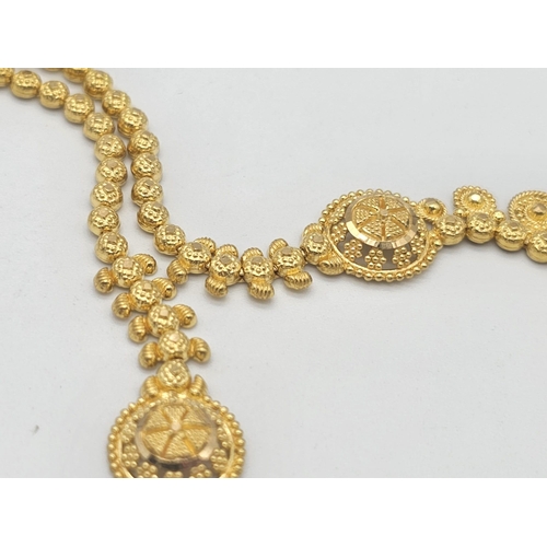 811 - A yellow gold mixed lot consisting of: 
22 K chain and six necklaces A/F
21 K bracelet and ring (siz... 