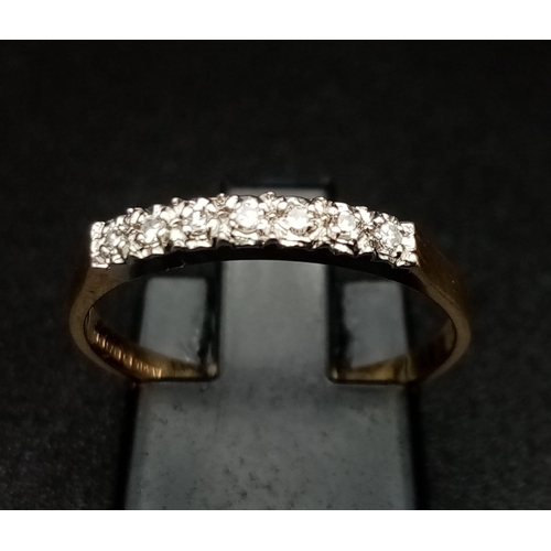 857 - 9K YELLOW GOLD DIAMOND SET BAND RING. TOTAL WEIGHT 1.3G.  SIZE N 1/2