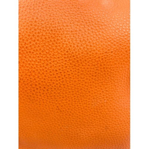 1456 - A Prada Burnt Orange Tote Bag. Soft leather with gilded hardware. Inner zipped and flap compartments... 