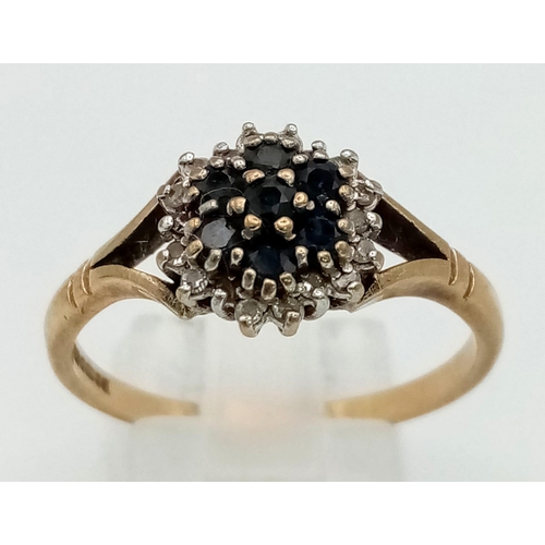 1370 - A 9K Yellow Gold Sapphire and Diamond Cluster Ring. Size V.
2.8g total weight.