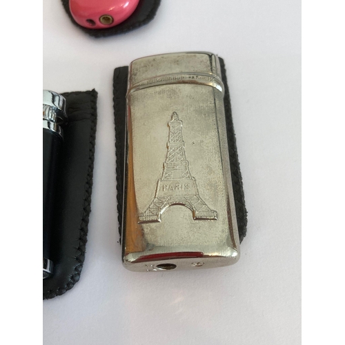 862 - Selection of vintage lighters in pouches to include a Jack Daniel‘s ,Gauloises,Paris,etc. UK Buyers ... 