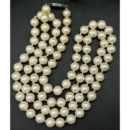 1401 - An Opera Length vintage  Pearl Necklace. 28 inches. Pearls - 8mm.