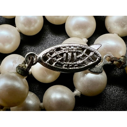 1401 - An Opera Length vintage  Pearl Necklace. 28 inches. Pearls - 8mm.