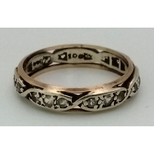 1209 - A 9K White and Yellow Gold White Stone Eternity Ring. Size M. 2.65g total weight.