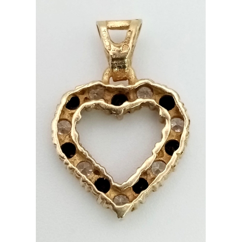 1328 - A 9K Gold Sapphire and White Stone Pendant. 1.6g total weight.